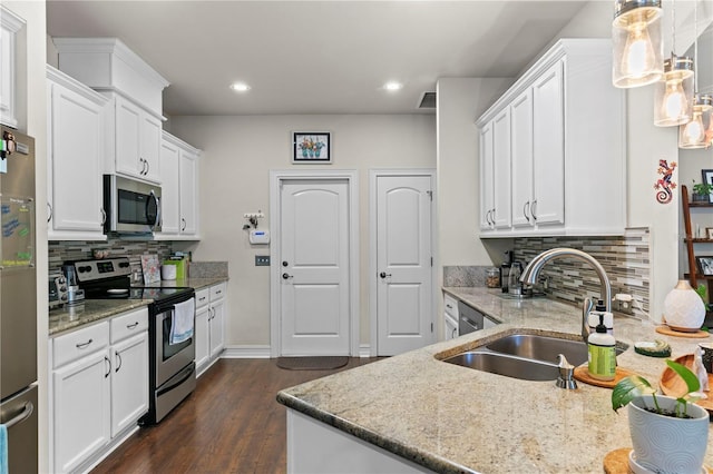 kitchen featuring sink, appliances with stainless steel finishes, and white cabinets