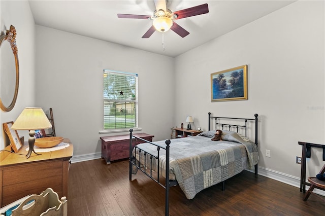 bedroom featuring dark wood-type flooring and ceiling fan