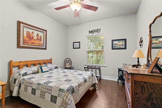 bedroom with ceiling fan and dark hardwood / wood-style floors