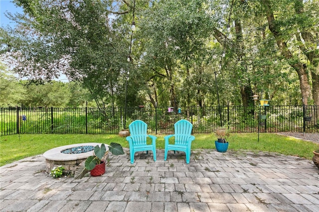 view of patio / terrace with an outdoor fire pit