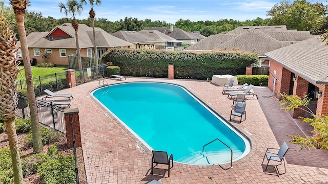 view of swimming pool with a patio