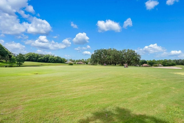 surrounding community featuring a lawn