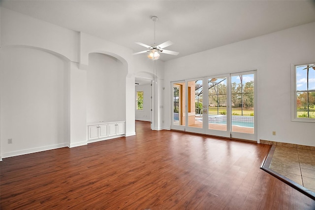 empty room featuring dark hardwood / wood-style floors and ceiling fan