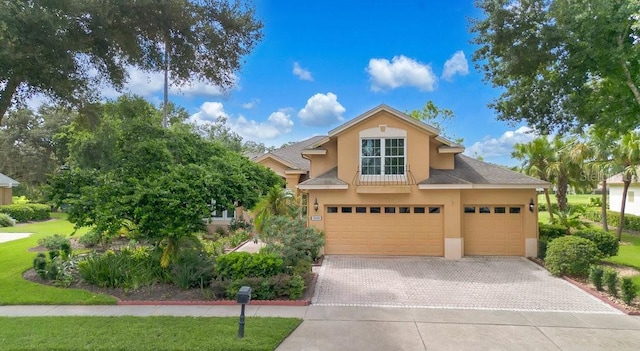 view of front of home with a garage and a front yard