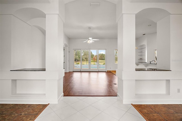 foyer entrance featuring ceiling fan and light hardwood / wood-style flooring