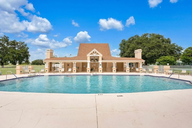 view of swimming pool with a patio