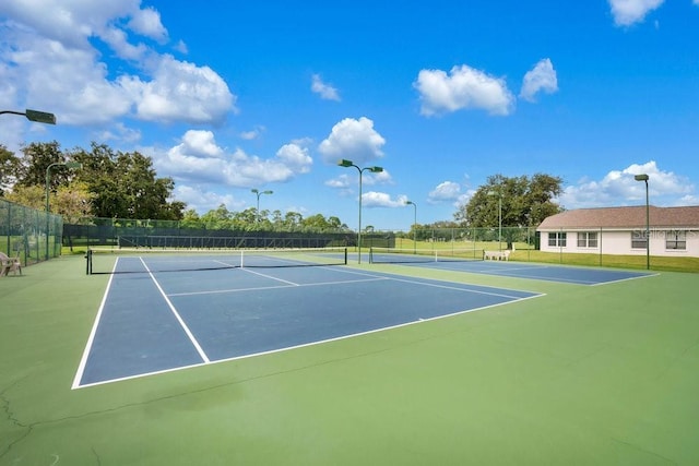 view of sport court with basketball hoop