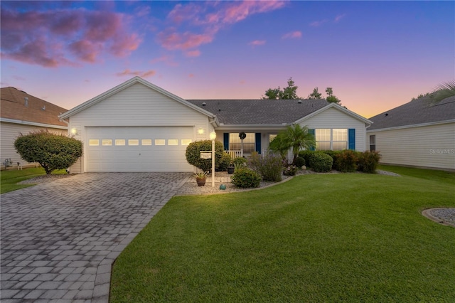 17913 SE 88th Cascade Ct, The Villages, FL 32162 - ranch-style home featuring a garage, a porch, a front yard, and decorative driveway