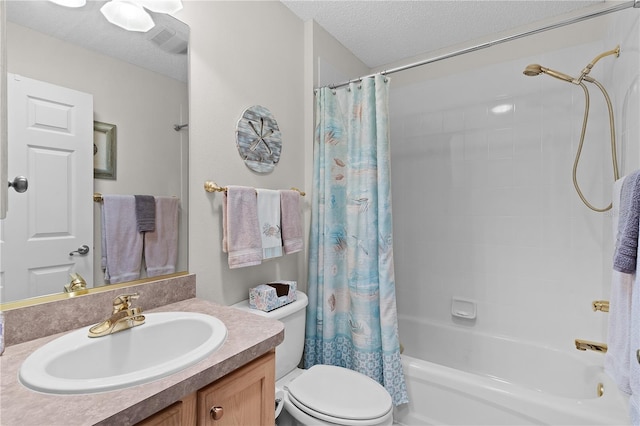 full bathroom featuring vanity, toilet, a textured ceiling, and shower / bath combo with shower curtain