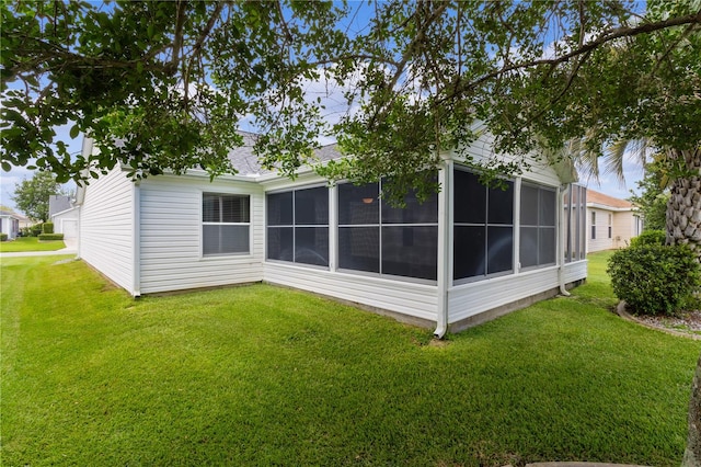 rear view of house with a yard