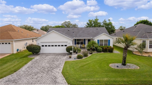 ranch-style home with a garage and a front yard