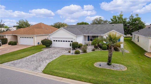 ranch-style home featuring a garage and a front yard