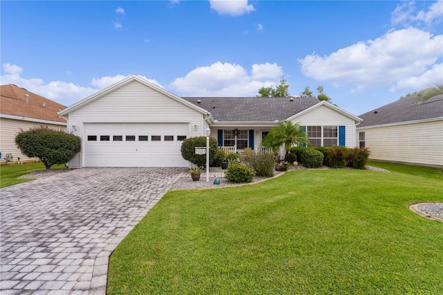 ranch-style home with a garage and a front yard