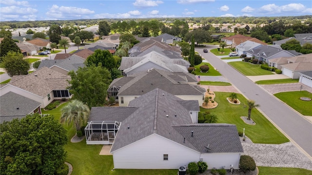 birds eye view of property with a residential view