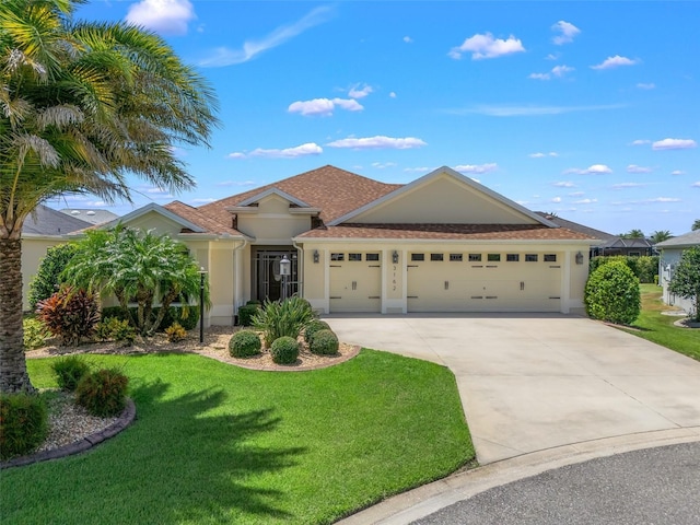 ranch-style home with roof with shingles, stucco siding, a garage, driveway, and a front lawn