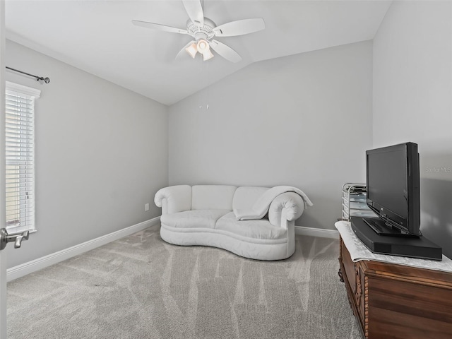 interior space with carpet floors, ceiling fan, and vaulted ceiling