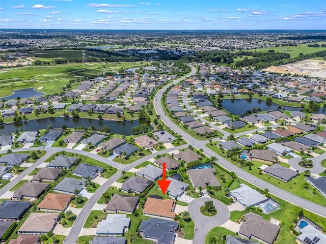 bird's eye view featuring a residential view and a water view