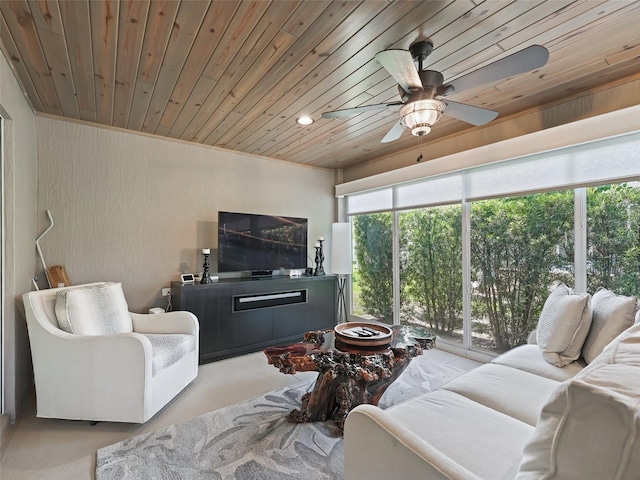 living room featuring wood ceiling, light colored carpet, and ceiling fan