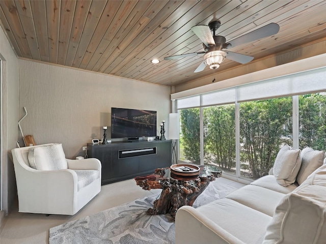 living room featuring ceiling fan and wooden ceiling