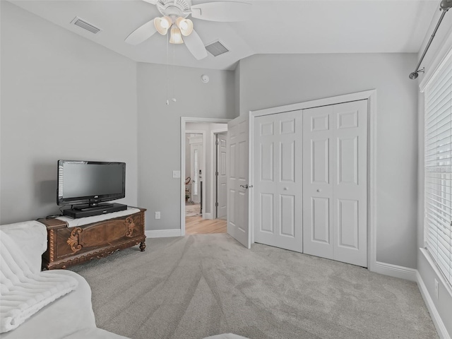 living room with vaulted ceiling, light carpet, and ceiling fan