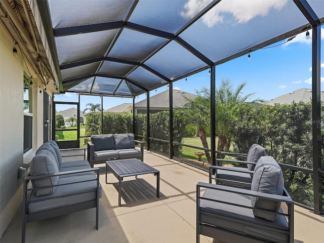 sunroom featuring a mountain view and lofted ceiling