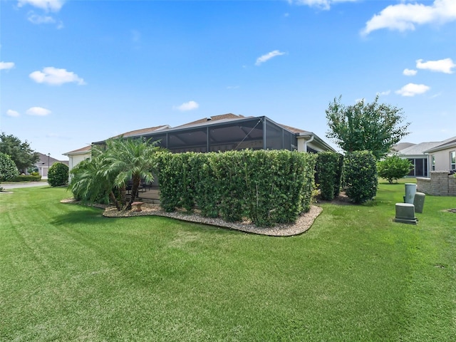 view of yard featuring glass enclosure