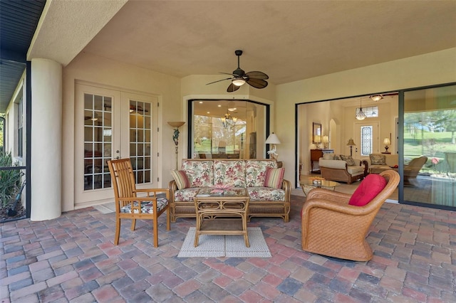 view of patio / terrace with french doors, ceiling fan, and an outdoor living space