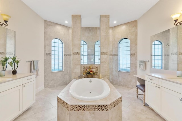 bathroom featuring a garden tub, tile walls, vanity, and walk in shower