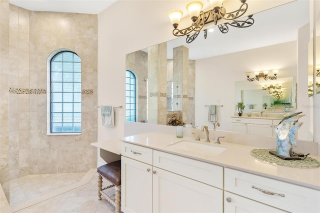 full bath featuring a wealth of natural light, a notable chandelier, and a walk in shower