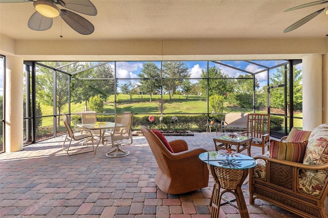 sunroom with a ceiling fan