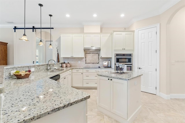 kitchen featuring ornamental molding, stainless steel double oven, a sink, and decorative backsplash