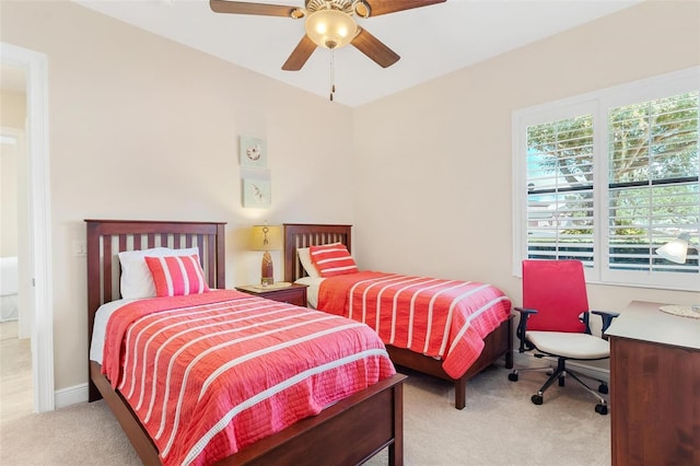 bedroom featuring ceiling fan, carpet floors, and baseboards