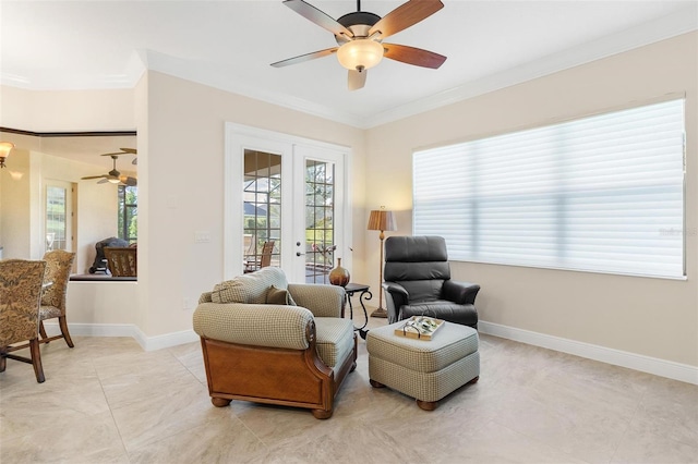 sitting room featuring ceiling fan, light tile patterned flooring, baseboards, french doors, and crown molding