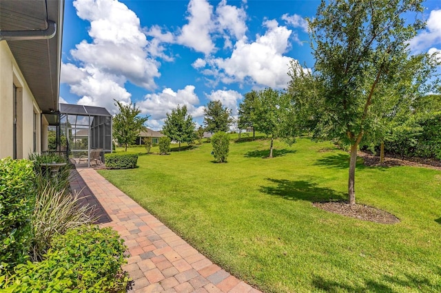 view of yard featuring a lanai