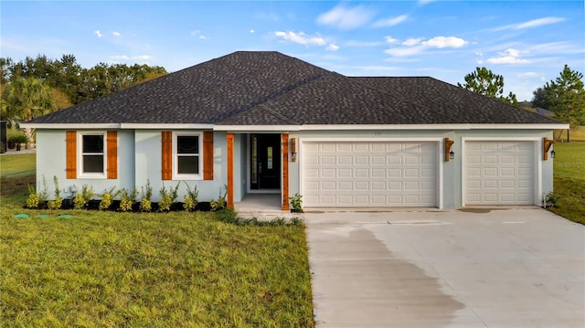 view of front of house featuring a front yard and a garage