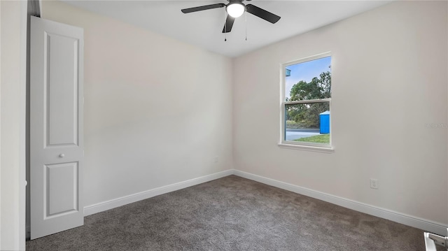 carpeted empty room with ceiling fan