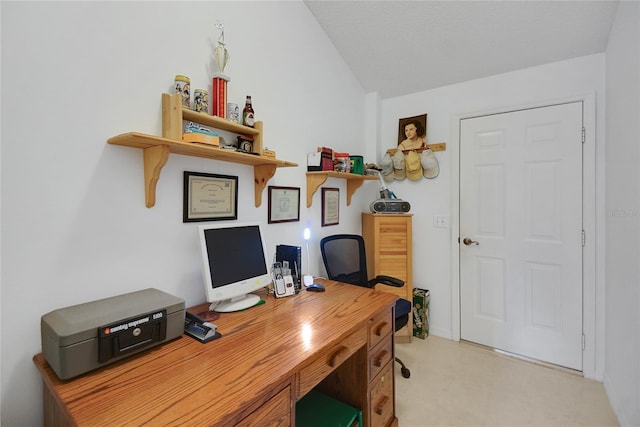 office area featuring vaulted ceiling