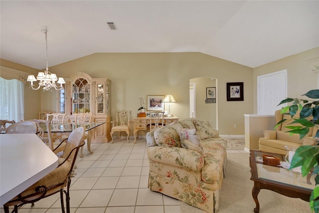 living room featuring light tile patterned floors, visible vents, arched walkways, an inviting chandelier, and vaulted ceiling