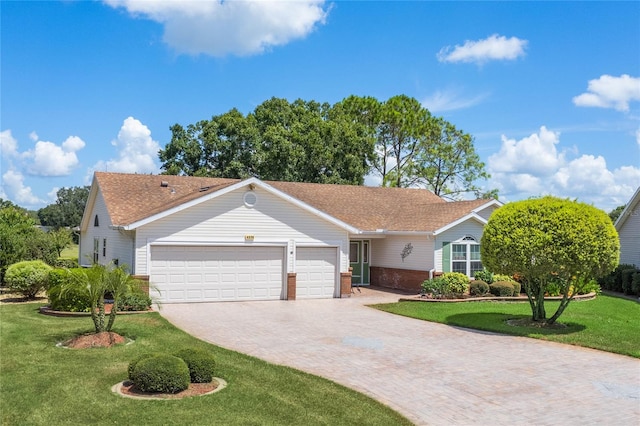 ranch-style home with a front yard and a garage