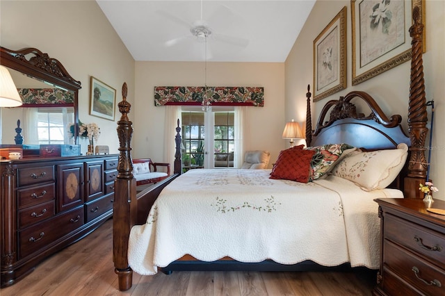 bedroom with lofted ceiling, wood-type flooring, and ceiling fan