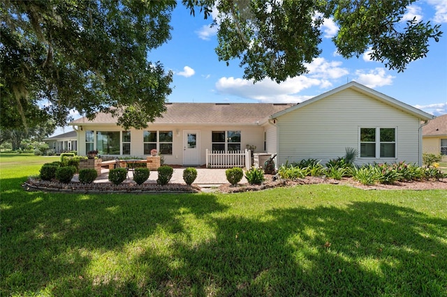 view of front of property featuring a patio area and a front lawn