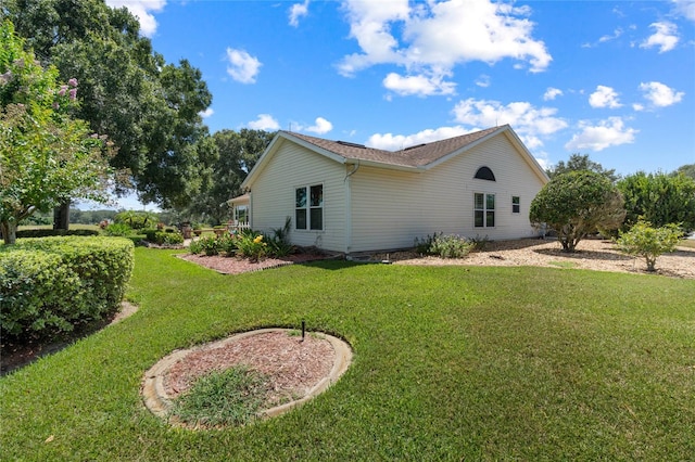 view of property exterior featuring a yard