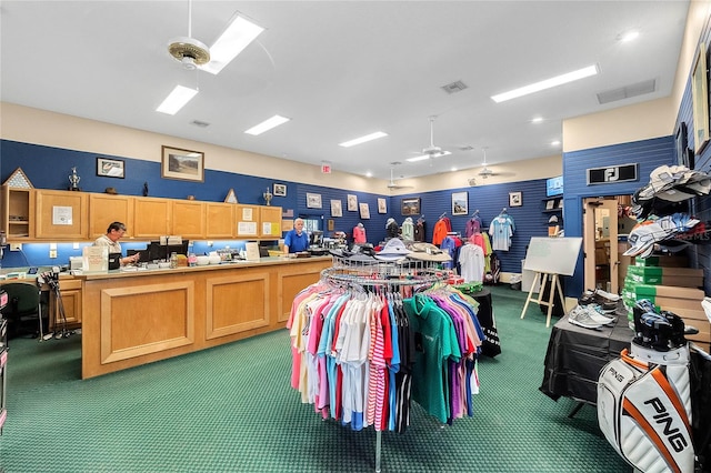 miscellaneous room featuring dark carpet and ceiling fan