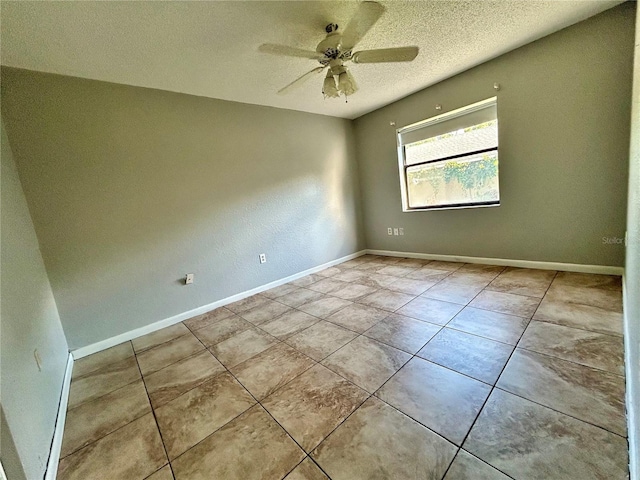 empty room featuring light tile patterned flooring, a textured ceiling, and ceiling fan