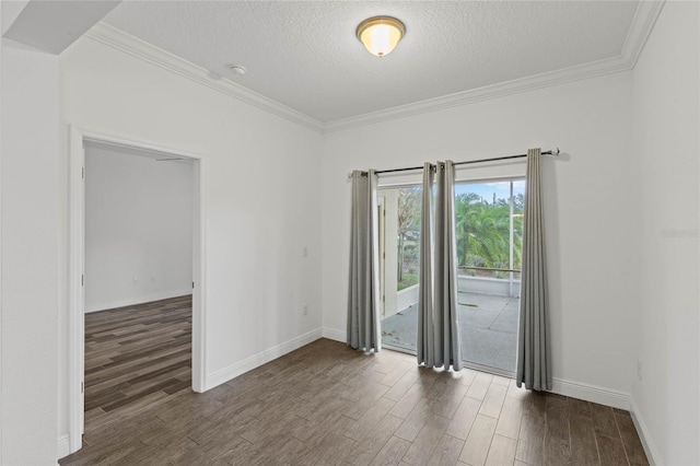 empty room with a textured ceiling and crown molding