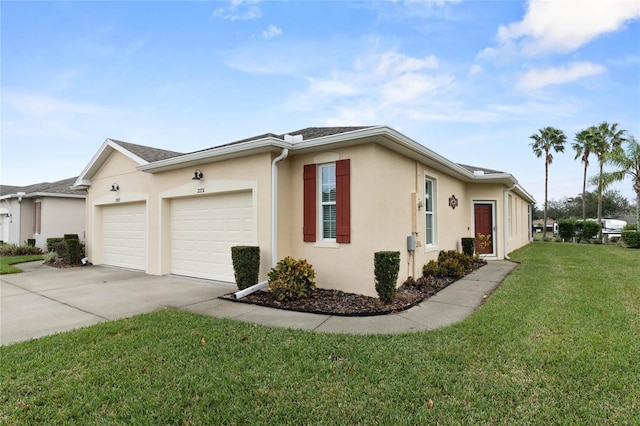 view of home's exterior featuring a garage and a lawn