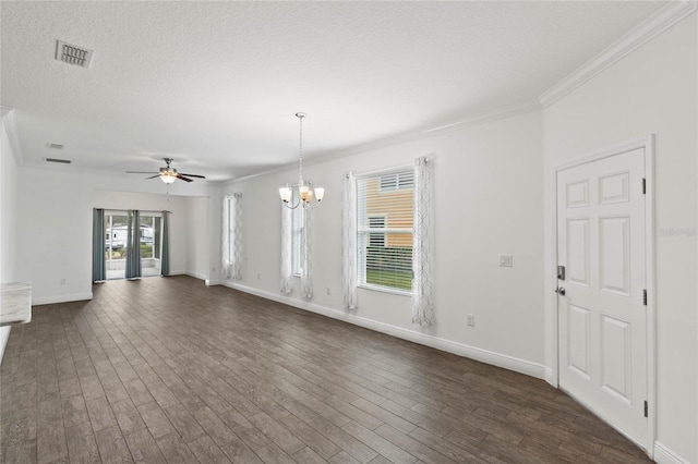 empty room featuring ceiling fan with notable chandelier, a textured ceiling, dark hardwood / wood-style floors, and crown molding