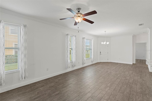 unfurnished room with plenty of natural light, crown molding, and dark hardwood / wood-style floors