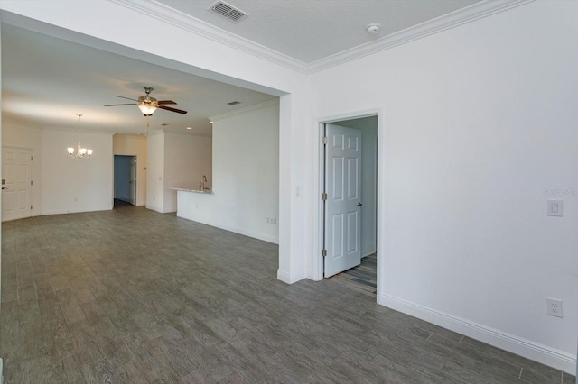 spare room featuring ceiling fan with notable chandelier, dark hardwood / wood-style floors, and crown molding