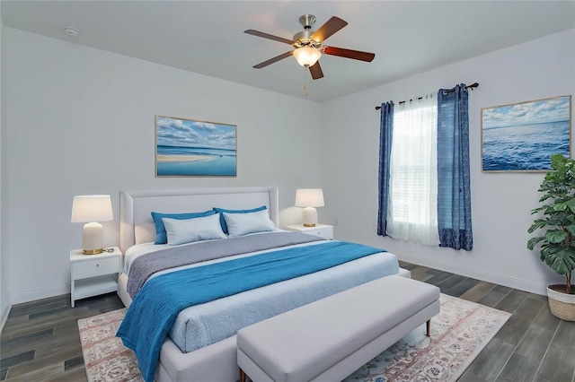 bedroom with dark wood-type flooring and ceiling fan